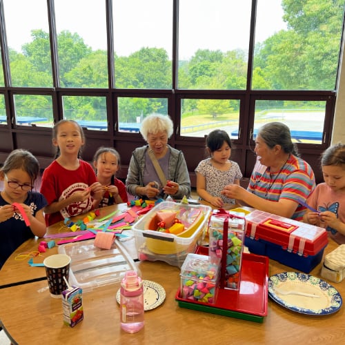 NWCS families creating paper crafts.